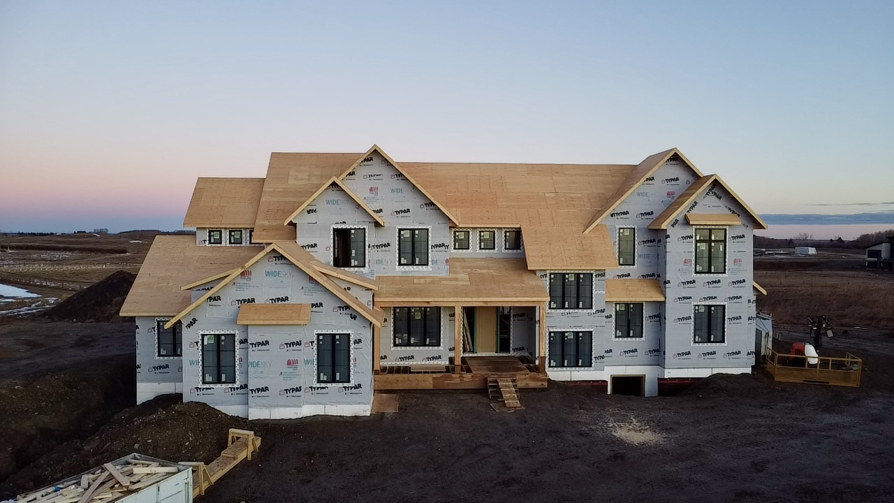 Framed two-storey residence photographed at dusk